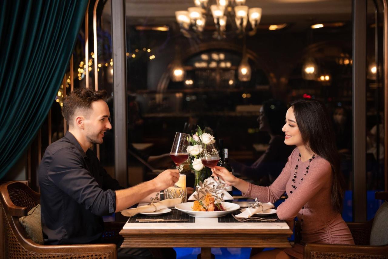 Peridot Grand Luxury Boutique Hotel Ханой Экстерьер фото A couple dining at a restaurant